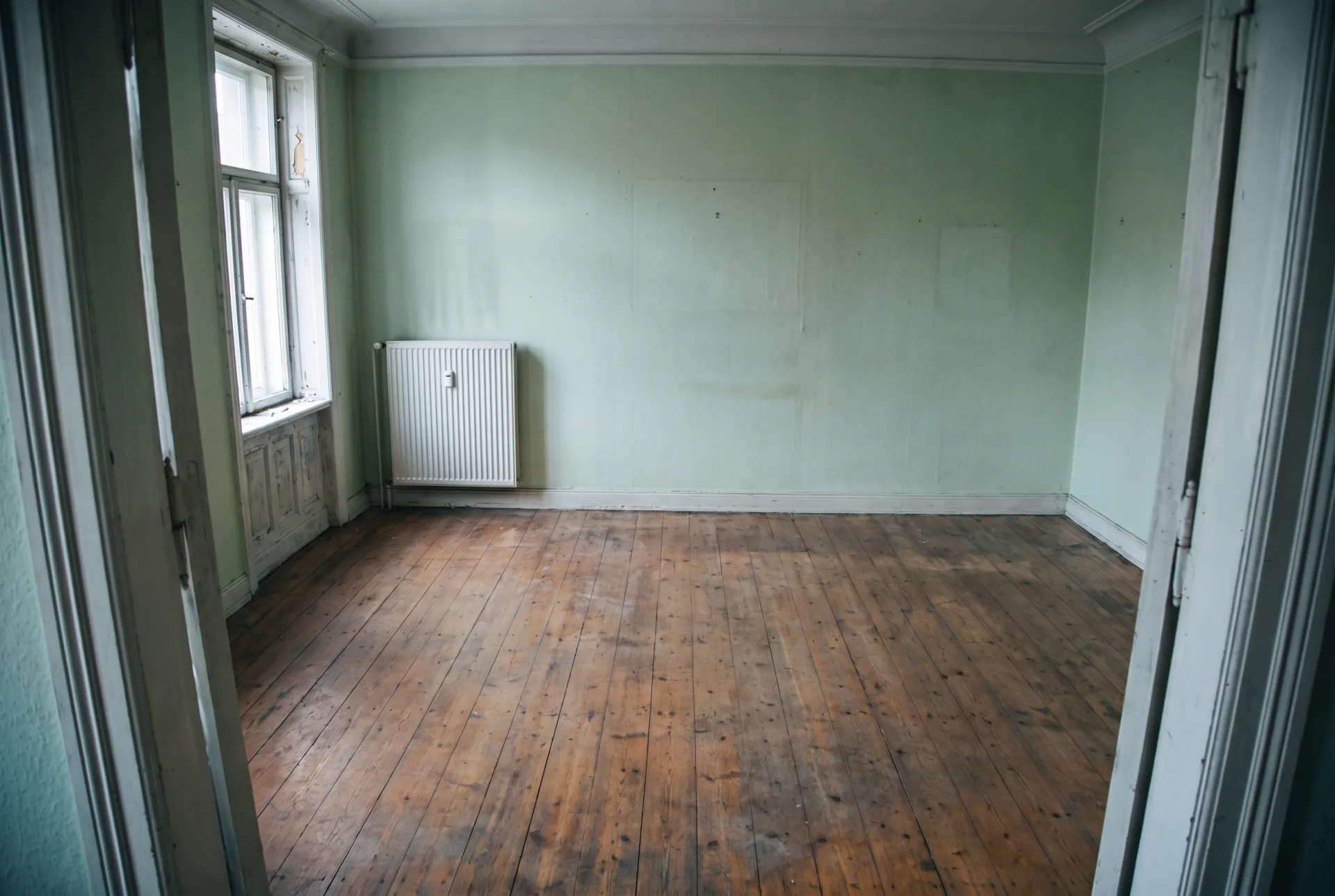 After: the same room empty, with the floor swept
